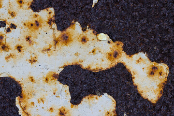 Fototapeta premium Texture of rusty metal with peeling paint. Rough metal surface with rust. Corroded and oxidized old iron. Rusted and aged metal sheet. Great for background and design in grunge style. High resolution.