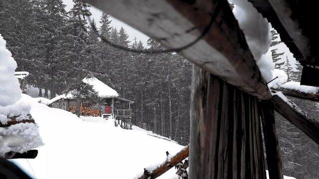 Snowing at the chalet in the mountains