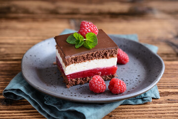 Delicious chocolate raspberry cheesecake, topped with chocolate frosting