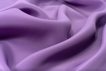 A piece of purple cloth. Fabric texture for background and design works of art, beautiful wrinkled pattern of silk or linen. A crumpled piece of cloth