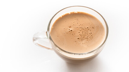Glass cup of cappuccino on a white background