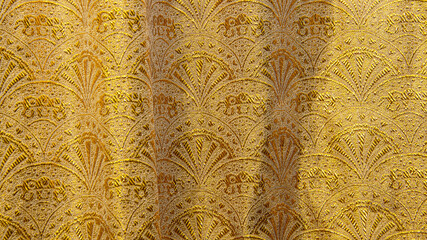 Gold floral ornament brocade textile pattern