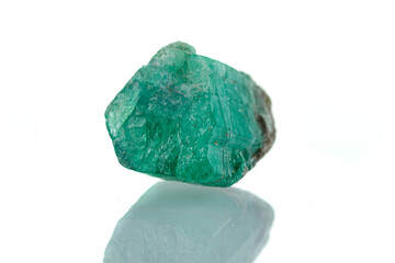 macro mineral stone emerald on a white background