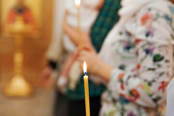 Orthodox Church. Christianity. Festive interior decoration with burning candles and icon in...