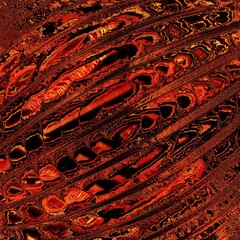 many diagonal red hot lines of flowing lava magnified by a single glass sphere