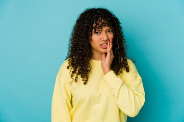 Young african american afro woman isolated having a strong teeth pain, molar ache.