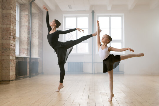 Woman and little girl dancing ballet