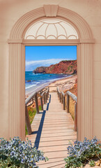 Fototapeta na wymiar view through arched door, boardwalk to the beach, Portugal Algarve