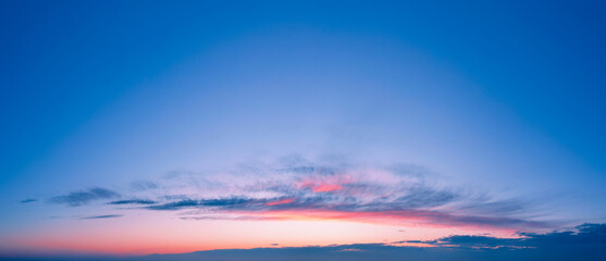 Fototapeta premium Romantic sunset sky background with beautiful clouds.