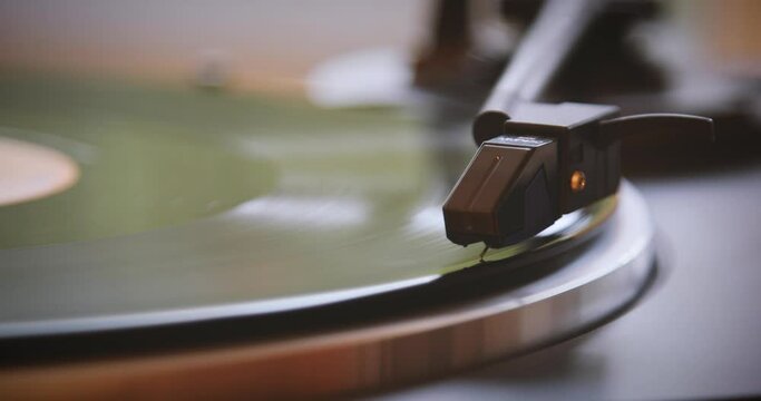 Vintage. The needle goes down on a vintage vinyl record. The vinyl record is spinning. The needle plays on a vintage vinyl record. Old turntable