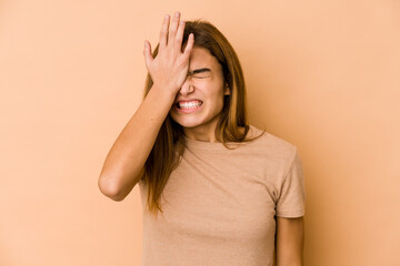 Young skinny caucasian teenager girl forgetting something, slapping forehead with palm and closing eyes.