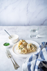 Steamed manta rays with meat sprinkled with dill in a plate