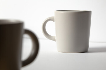Ceramic white espresso cup against a plain white background coffee cafe art.