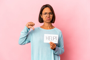 Young hispanic mixed race woman holding a help poster showing a dislike gesture, thumbs down....