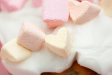 cupcake with hearts from marshmallow closeup macro photo