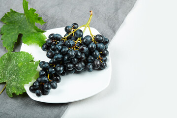 A bunch of red grapes on white background