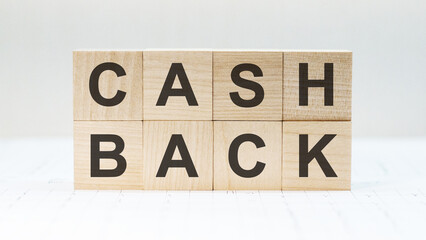 CASH BACK written on a wooden cube. The total amount of debt that a company has on its balance sheet.