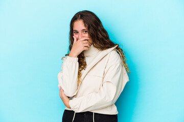 Young caucasian curly hair woman isolated laughing happy, carefree, natural emotion.