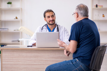 Old male patient visiting young male doctor