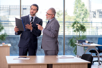 Two businessmen discussing business project
