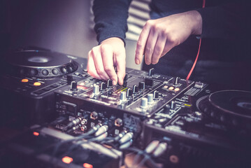DJ at the remote control. Mixer remote at concert. Musical equipment.