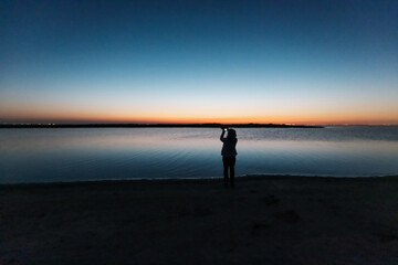 silhouette of a person on the beach