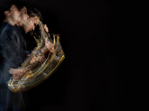 A Stroboscopic Image Of A Male Saxophone Player In Motion Against A Black Background