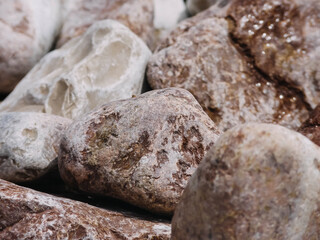 Fototapeta na wymiar Pebbles on the coast. Natural background for your projects. Travel concept.