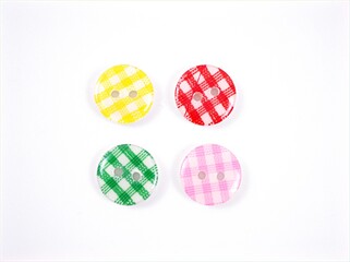 Colorful plastic sewing buttons isolated on white background