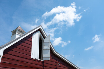 red barn against blue sky