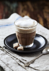 Coffee with milk on dark wooden background. Close up.	