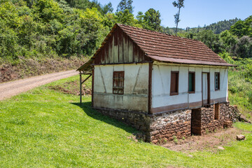 Fototapeta na wymiar Small enxaimel house with vegetation around