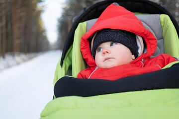 adorable 7 month baby in stroller winter time 