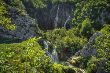 Long queue of tourists on a boardwalk to see Veliki Slap, the highest waterfall in Plitvice Lakes, National Park UNESCO World Heritage, Croatia