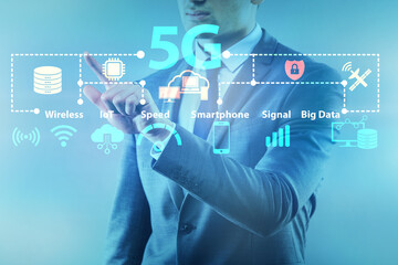 Businessman pressing button in 5g concept