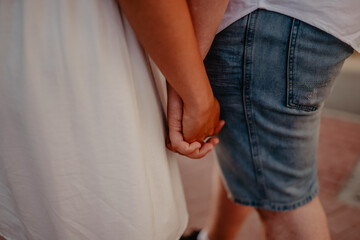 guy and the girl held hands. love and friendship.