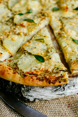 slice of pizza separated from the main part of the pizza.