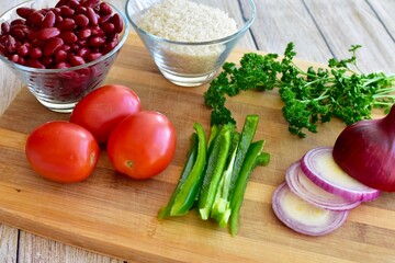 Whole organic fresh ingredients for making homemade tasty healthy vegetarian hearty one pot winter comfort chillis, soups and stews