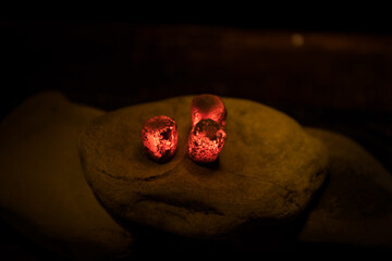 Close-up of burning charcoal cubes. Action. Cubes of embers burning in bowl for smoking hookah....