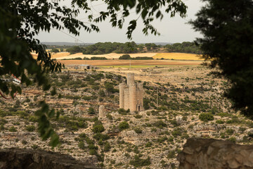 Landscape with a watchtower of the fortified city of Alarcon from the castle on a cloudy day, Cuenca, Spain