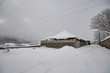 Winter mountain village landscape with snow and cute little houses, beautiful nature panoramic background