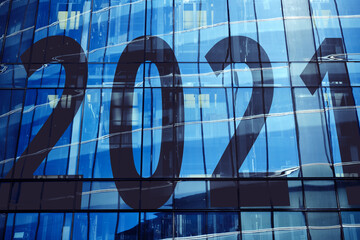 Year 2021 on the facade of a skyscraper on a bright day.