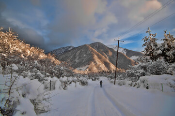 Majestic sunset in the winter mountains landscape. Dramatic sky. Azerbaijan nature.