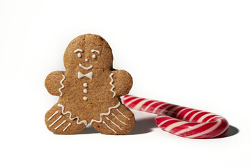 Gingerbread man with shadow and lollipop isolated on white background