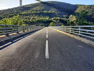 A summer panorama of a great white cable bridge. Bridge crossing the valley.  Natural panoramic...