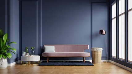 Interior of light room with sofa on empty dark blue wall background.