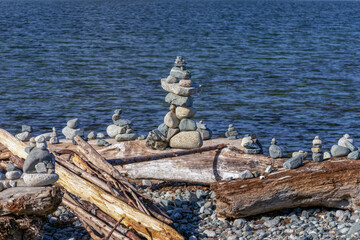 Inuksuk sculpture on a beach environmental art