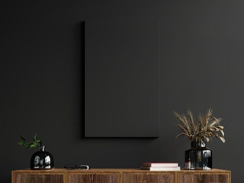 Mockup frame on cabinet in living room interior on empty dark wall background.