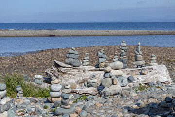 Inuksuk sculpture on a beach environmental art