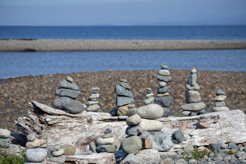 Inuksuk sculpture on a beach environmental art